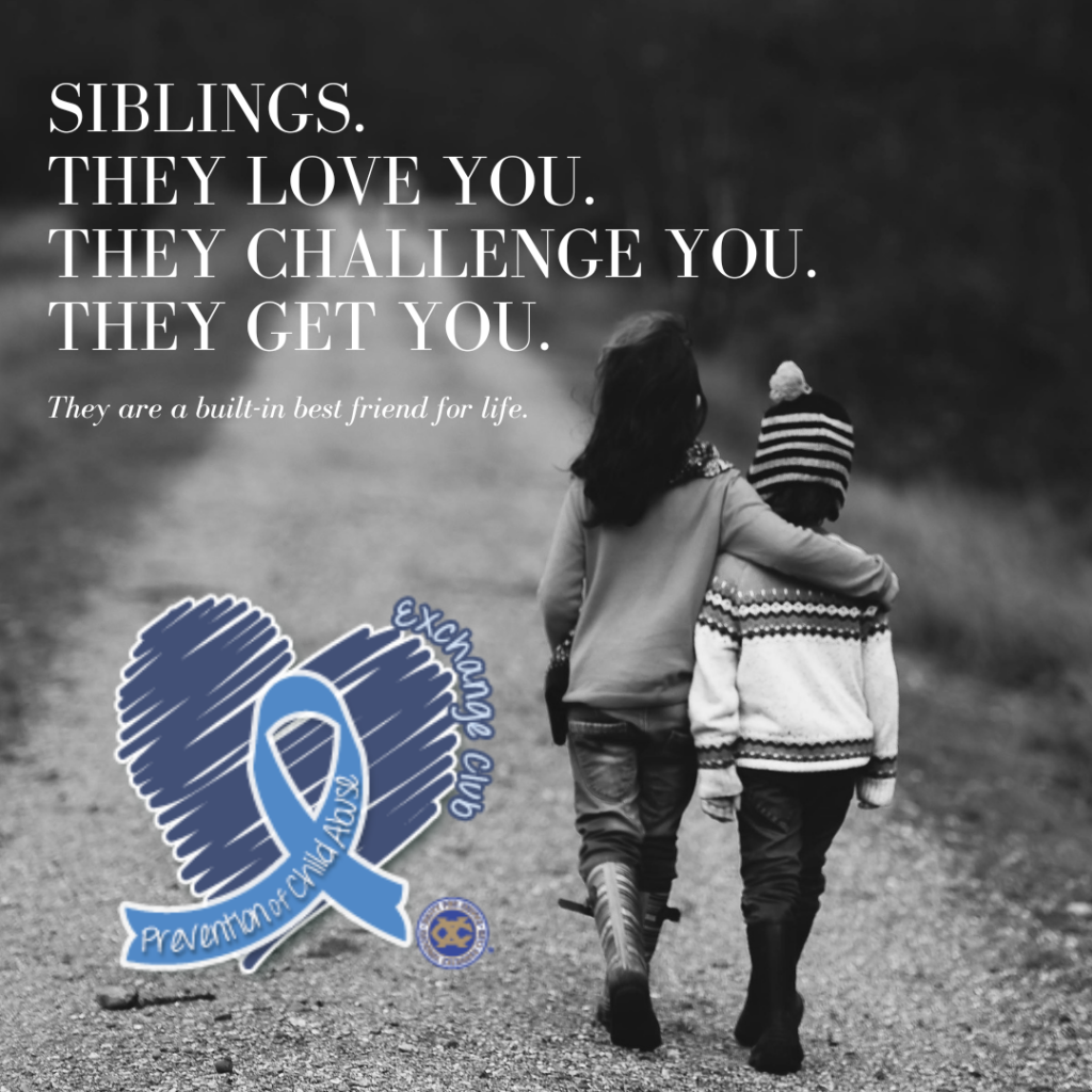 a girl and boy walking on a gravel path